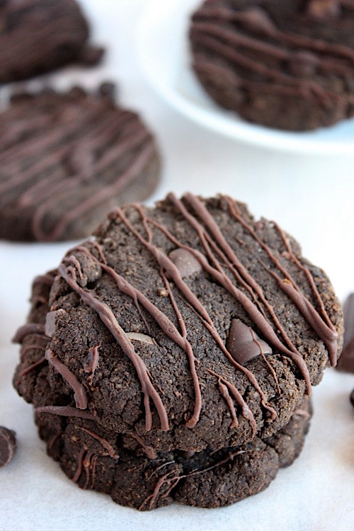  Espresso Choc Chip Cookies {Gluten Free, Grain Free & Paleo Friendly} July 26, 2016 Print Friendly Espresso Choc Chip Cookies {Gluten Free, Grain Free & Paleo Friendly} So tell me, how was your weekend? Where did you go? What did you do? Who did you see? Did you get/do/go/see/eat anything fun? Tell me, tell me details please?! Espresso Choc Chip Cookies {Gluten Free, Grain Free & Paleo Friendly} Me?! Oh. My. Word . . . You guys, What a weekend! On Saturday we had our little lady’s 7th birthday celebration! I still can’t believe I have a 7 year old?! Seriously how?! I also can’t believe how loud a small group of teeny, tiny, super sweet looking 7 year old girls can be?! Seriously, wow! Espresso Choc Chip Cookies {Gluten Free, Grain Free & Paleo Friendly} Our girl had the best time, she said it was everything she hoped it would be, and more and even went as far as to declare that it was the “best birthday ever” so exhausted (and deaf) as I may be, sweet comments like that make it all worth it. Now, I don’t know about you but after all that fun I could really do with a cookie (or 2) and some quiet time. Care to join me? You guys, these espresso choc chip cookies are just what the doctor ordered! Espresso Choc Chip Cookies {Gluten Free, Grain Free & Paleo Friendly} They are subtly sweet, deliciously buttery, seriously chocolatey, stuffed with choc chips and have a divine little hum of espresso! These cookies are seriously tasty and I know you are going to just love, love, love them! A healthier twist on a dark and delicious, double chocolate cookie that comes together in 1 bowl in less than 20 minutes and also delivers a sneaky hit of caffeine?! I mean seriously what’s not to love?! Espresso Choc Chip Cookies {Gluten Free, Grain Free & Paleo Friendly} Chocolate + cookies + coffee = happiness. Seriously though, who doesn’t love a good cookie?! And let me tell you, these cookies are the goods! Not only are they insanely, and I mean INSANELY, delicious but, they also happen to be super quick and easy to prepare. Espresso Choc Chip Cookies {Gluten Free, Grain Free & Paleo Friendly} Made with no refined flours or sugars using just a handful of ingredients that I bet you have on hand already and they come together in one bowl and are ready in less than 20 minutes! They also happen to be gluten free, grain free and paleo friendly but you guys . . . did I mention the fact that they are insanely delicious!? Because they really, truly are! Espresso Choc Chip Cookies {Gluten Free, Grain Free & Paleo Friendly} Fresh from the oven your cookies will have this perfectly light and deliciously crisp, crunchy exterior. Then, once you bite through that crispy outer shell, you get this subtly sweet, deliciously buttery, melt in the mouth, choc chip studded, intensely chocolatey, fudgey center that is nothing short of divine. In the days that follow your cookies will lose some of that fresh baked crispness but they still taste all kinds of amazing. I love the way the combination of coconut and almond flour produces these hearty yet light cookies and I think we can all agree that chocolate and coffee just makes everything better. Espresso Choc Chip Cookies {Gluten Free, Grain Free & Paleo Friendly} I really like the way that the coconut flour helps keep your cookies light and tender while at the same times adding a touch of subtle sweetness. The sweetness of the coconut flour is balanced out so perfectly by the slightly buttery, nutty flavour of the almond flour – it really is a match made in heaven! Which is exactly what these cookies taste like. A little slice of heaven. Decadent and rich chocolate cookies that are choc full of choc chips and have a divine little hum of espresso ♥♥♥ Espresso Choc Chip Cookies {Gluten Free, Grain Free & Paleo Friendly} Yep that pretty much sounds like heaven to me! Note – If you’re not a coffee addict lover like me clearly we can not longer be friends then feel free to just omit the espresso and make yourself some chocolate choc chip cookies instead 😉 So yep . . . cookies . . . I made some, and I really think you should too. They are super quick and easy to prepare – crisp and crunchy on the outside, with a slightly fudgey, intensely chocolaty, brownie like centre, stuffed with choc chips and have a divine little hum of espresso. Espresso Choc Chip Cookies {Gluten Free, Grain Free & Paleo Friendly} You need them in your life, asap! Pour yourself a a big ol’ glass of milk and just do it already! All natural, quick and easy, decadent, rich, subtly sweet, deliciously buttery, seriously chocolatey, choc chip studded, melt in the mouth cookies with a divine little hum of espresso! Make them. Eat them. Love, love, love them. Espresso Choc Chip Cookies {Gluten Free, Grain Free & Paleo Friendly} Espresso Choc Chip Cookies {Gluten Free, Grain Free & Paleo Friendly} Makes approx 12 All natural, quick and easy, decadent, rich, subtly sweet, deliciously buttery, seriously chocolatey, choc chip studded, melt in the mouth cookies with a divine little hum of espresso! Ingredients – 1 egg 1 teaspoon of vanilla extract 1/4 cup of coconut oil, melted and cooled 1/4 cup coconut sugar 1/4 cup coconut flour 1/2 cup almond flour 2 Tablespoons cacao 1 teaspoon of instant espresso 1/2 teaspoon of baking soda A pinch of salt 2 Tablespoons of dark chocolate chips (or cacao nibs), roughly chopped Method – 1 – Preheat oven to 175’C (350’F) 2 – Line a baking sheet with baking/parchment paper and set aside. 3 – In a medium size bowl, whisk together your egg, coconut oil and vanilla until combined. 4 – Next add your almond, coconut flour, sugar, cacao, espresso, baking soda and salt stir until it comes together to form a dough. 5 – Add chocolate chips and stir to combine – note – I roughly chopped added 1 Tablespoon which I added directly to the dough and melted the remaining Tablespoon to drizzle over the top after baking – do what you feel 😉 6 – Scoop a small portion of cookie dough into your hands and form into your desired shape and size then place onto your prepared baking sheet. 7 – Repeat until all the mixture has been used. FYI – I used 1 heaping Tablespoon of cookie dough per cookie and was able to get 12 bite size beauties out of this mixture. Feel free to make them as big, small, thick or thin as you like just remember you may need to adjust the baking time slightly depending on the shape and size you choose 😉 8 – Once you have all your cookies shaped bake for 6-8 minutes until the tops are slightly crisp. 9 – Remove from the oven and allow to cool on the baking sheet for 5-10 minutes before transferring to a wire rack to cool completely. 10 – If you’re going to add the chocolate drizzle simply melt your remaining Tablespoon of dark chocolate chips by your preferred method and drizzle over the tops. YUM! Note – Cookies keep well when stored in an airtight container for up to 5 days (if they last that long 😉 ) and can be frozen for up to 3 months. Enjoy xoxo _________________________________________ Question of the day – What’s your all time favourite cookie? Feel free to share recipes, or links to your fave recipes in the comments below or on the Facebook page and please for the love of all that is good in this world when you do make your cookies (or any of the recipes you find on this blog of mine) go ahead and snap a pic and share it either on the Facebook page, or tag me on twitter or Instagram. Sharing is caring remember. Do it, do it You know you want to :) __________________________________________